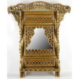 A Turkish giltwood and grey painted mirror backed wall bracket, 82cm