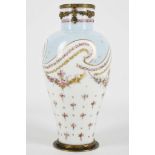 An early 20th century French Sevre style bottle shaped porcelain vase, enamelled with bouquets of