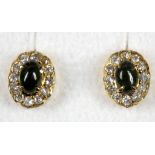 A pair of yellow gold and yellow tourmaline set and white sapphire stud earrings