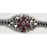 A diamond and ruby bracelet set in 18ct white gold, approx. 7cts