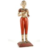 AN INDIAN PAINTED POLYCHROME WOODEN FIGURE OF A LA