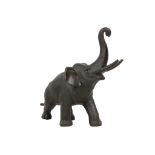 A JAPANESE BRONZE ELEPHANT. By Genryusai Seiya, Meiji Period. Cast with the trunk raised, signed