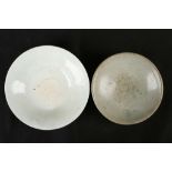 A CHINESE PALE CELADON BOWL TOGETHER WITH A QINGBAI BOWL. Song Dynasty. 12/14cm diameter. (2). 宋代