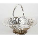 An early 20th century hallmarked silver oval shaped fruit basket, raised on oval shaped base,