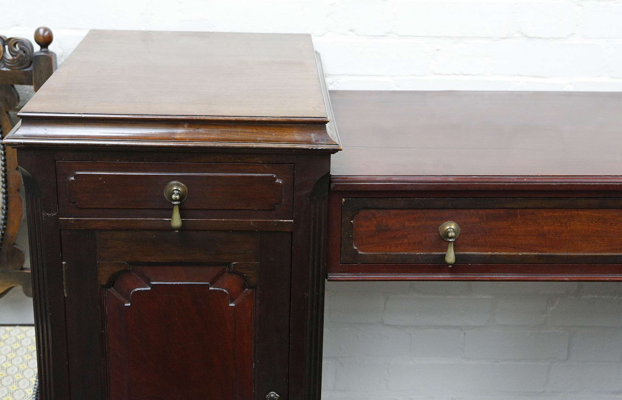 An Edwardian mahogany sideboard with central drawer over an open recess flanked by two pedestals, - Image 2 of 3