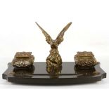 A late Edwardian desk standish with repousse bronz