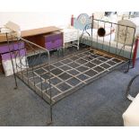 A French 19th century cot bed, iron and steel, scroll decoration with sun burst motif, 183 x 97cm