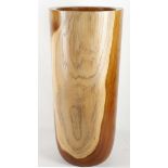 A tropical hardwood cylindrical stick stand in the form of a vase