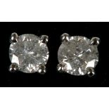 A pair of 18ct white gold and diamond studs, diamond: 0.30ct