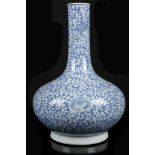 A BLUE AND WHITE PEAR SHAPED VASE. 18th / 19th Century. Decorated in underglaze blue with peony