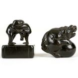 TWO JAPANESE BOXWOOD NETSUKE. Meiji, late 19th Century. One formed as a Buddhist lion dog playing