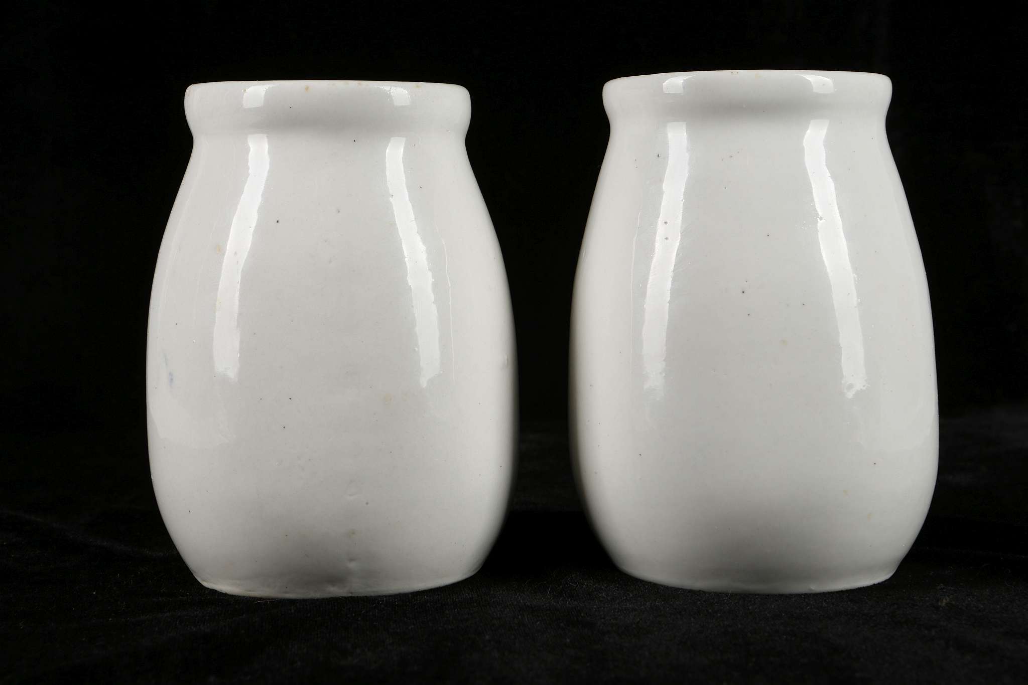 A PAIR OF CERAMIC MILK BOTTLES.  Mid 1960s.  Thickly potted, with a swelling body, a thick neck - Image 3 of 6