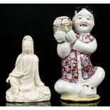 A CHINESE DEHUA GUANYIN TOGETHER WITH A PORCELAIN VASE FORMED AS A SEATED BOY. Late Qing /