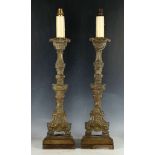 A pair of Rococo style candlesticks (now converted