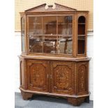 An 18th century Dutch marquetry glazed cabinet with broken pediment above shaped shelves above two