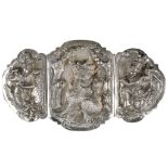 A BURMESE SILVER REPOUSSE DECORATED BUCKLE. 19th Century. The central insert decorated with a