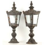 A pair of distressed metal four glass lanterns (2)