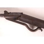 An antique 'break' barrel spring and composition 1.77 air rifle with walnut stock target sights, and