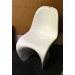 A post modernist moulded white plastic Panton chair