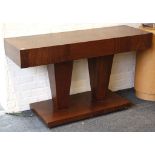 A modern designed consul table, the rectangular top on twin pedestals on a rectangular base