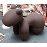 A brown upholstered novelty chair in the form of a panda
