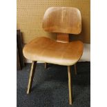 A laminated cherrywood chair, after a design by Eames