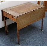 A 19th century mahogany and cross banded Pembroke table with end drawers raised on turned legs