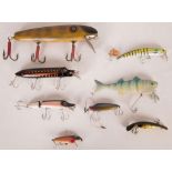 A collection of eight predator 'plug' lures comprising an original Aeddon wood 'vamp' articulated