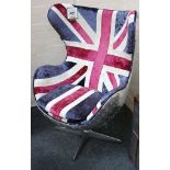 A retro aviation aluminium chair lined with Union Jack fabric and cushion