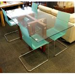 A post modernist rectangular glass top table, raised on a twin pedestal base, joined by stretcher,