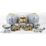 A collection of interesting Chinese ceramics, including a pair of reclining figures and two