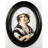 A hand painted continental porcelain plaque of a young girl holding a bouquet of flowers, in an