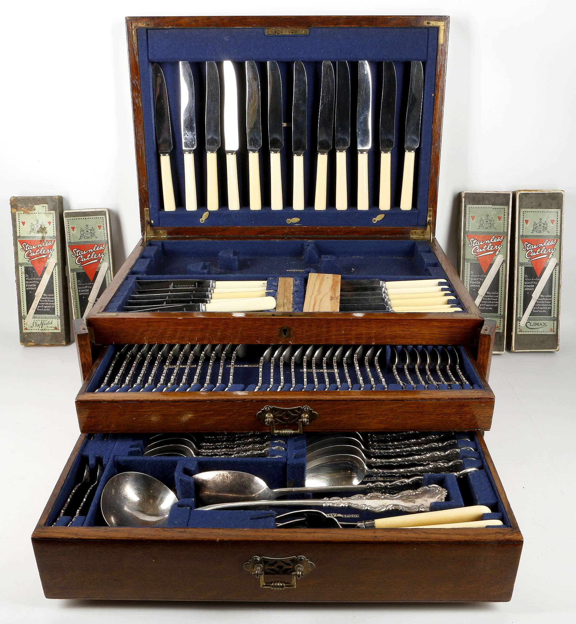 An oak canteen of silver plated flatware and cutlery in the King pattern, to include knives,