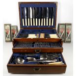 An oak canteen of silver plated flatware and cutlery in the King pattern, to include knives,