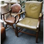 An Edwardian mahogany open armchair with leather upholstered back, arms and seat, supported on