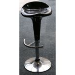 A black rigid plastic post-modernist stool on chrome metal base