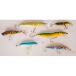 A collection of six vintage floating, diving and articulated plug luresincluding a rainbow trout and
