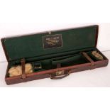 An early 20th century shotgun carry case by Fred Baker of Glasshouse Street, Piccadilly Circus,