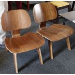 A pair of Charles Eames style L.C.W. chair in laminated walnut (2)