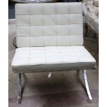 A chrome metal and cream leather upholstered Barcelona chair