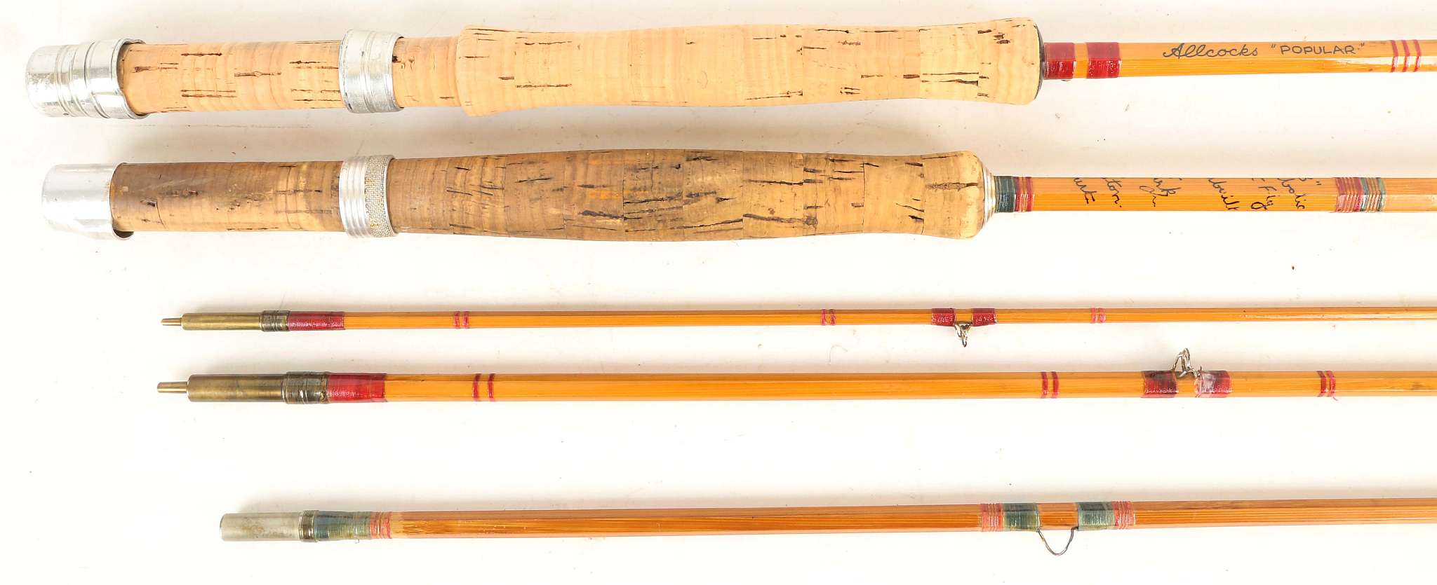 An R. Kirk of Hampshire handmade split cane 8' 8" fly rod, and an Allcock's 'popular' 9ft three