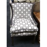 A pair of modern chairs upholstered in various shades of grey with close stud work and contrasting