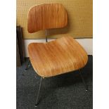 A rosewood and chrome metal Eames inspired chair