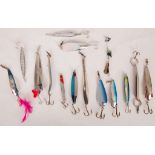 Fifteen various jiggers and spinning lures including 'Tobies', a fllipper - 28, an Effzett, some