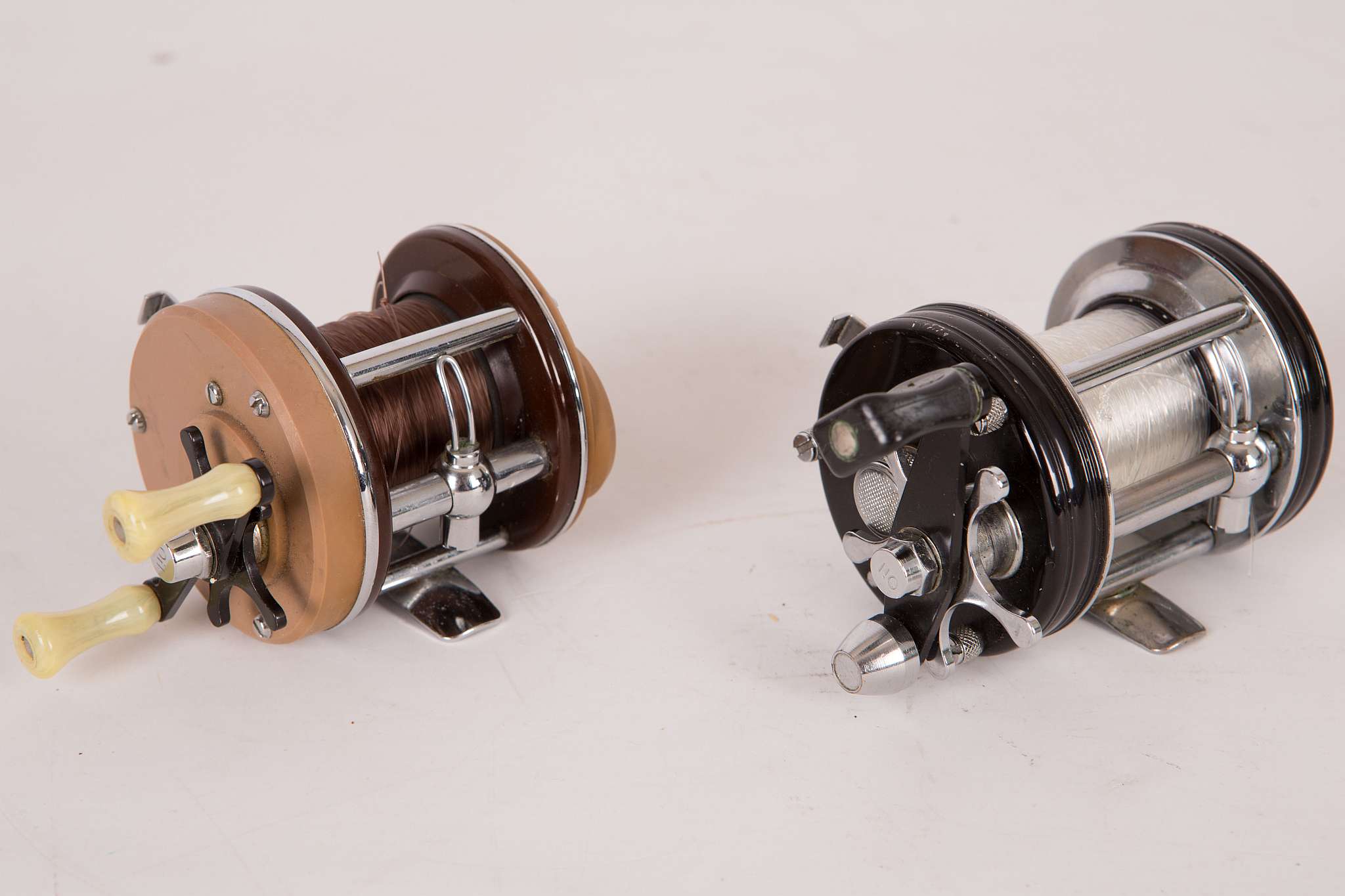 A chrome and black ABU (Sweden) 'Ambassador 6000c' multiplying reel and an ABU 3000 multiplying reel