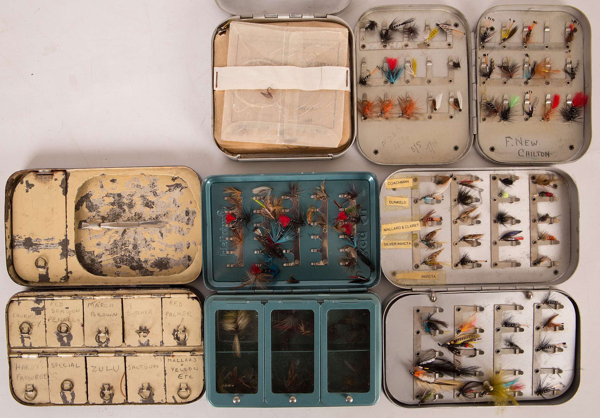 Two Wheatley metal fly boxes and contents of wet and dry flies, a metal box of dry flies for