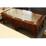 A mahogany cartouche top low table with a mirrored top, the sides and top with scrolling paint