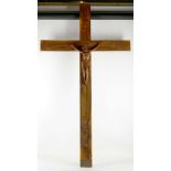 A large curved wooden crucifix with Christ appealing to Heaven (the cross in olive wood), and a