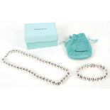 An original Tiffany & Co. sterling silver ladies necklace and matching silver bangle, in original