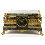 A neo-classical style gilt metal mounted and green marble table clock